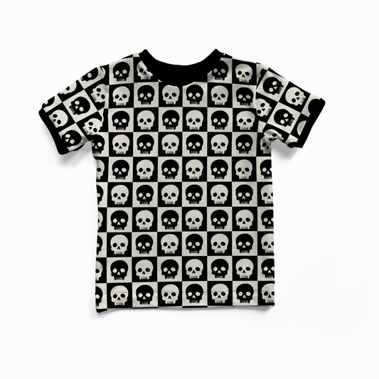 T-shirt with black and white checkered skull pattern on a white background
