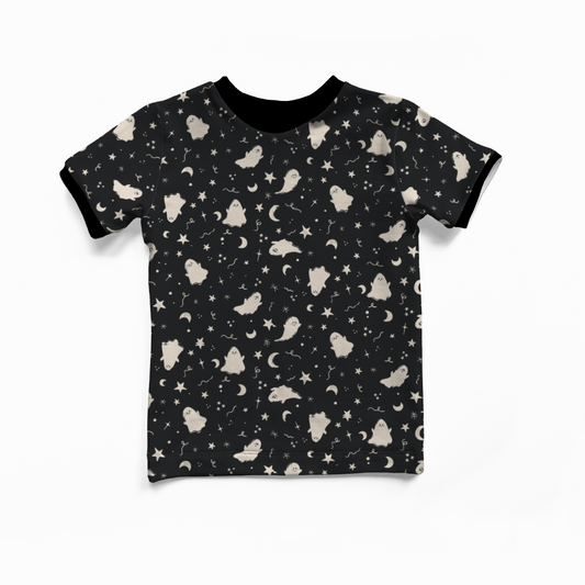Black t-shirt with white ghosts, moons and stars pattern on a white background