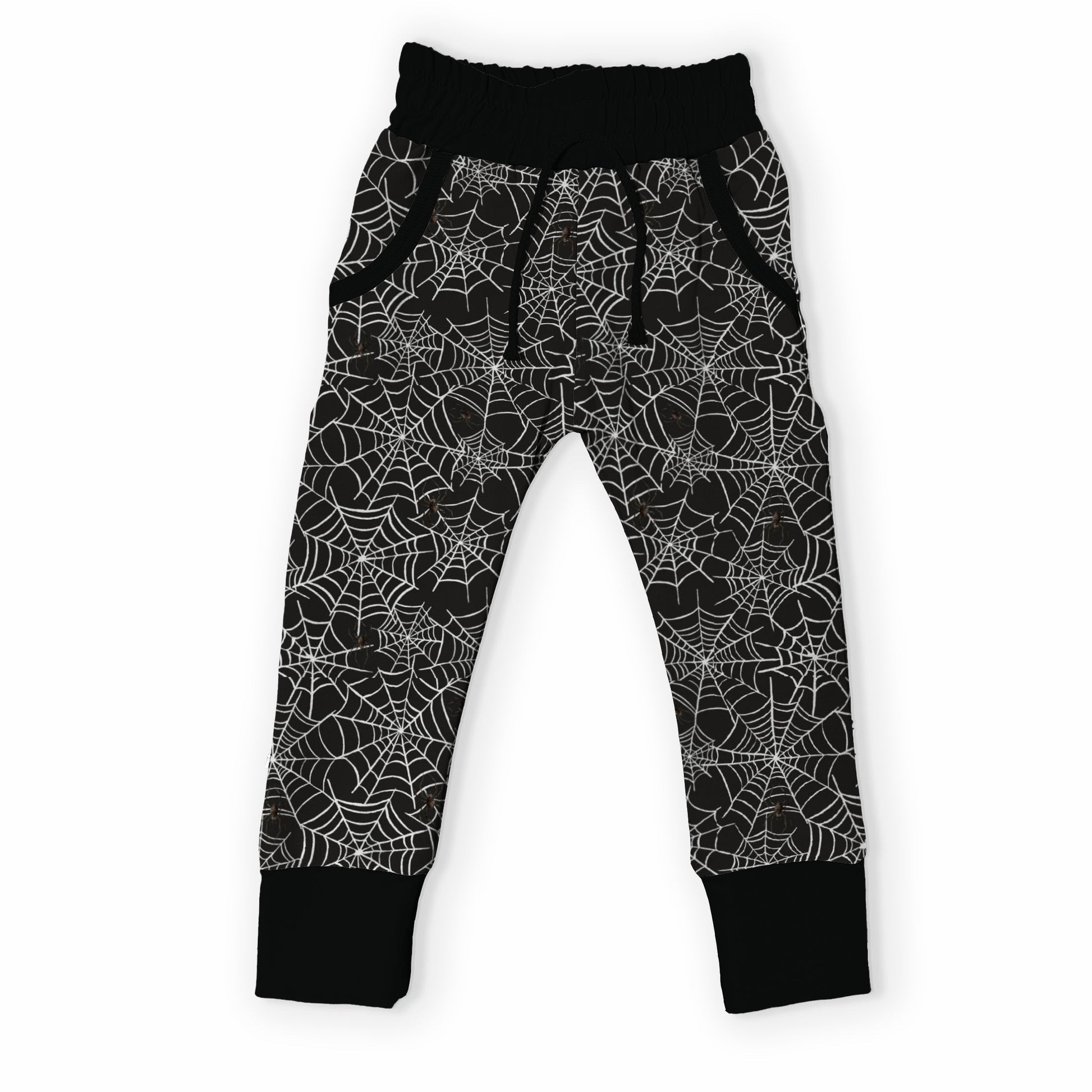 Black and white spiderweb patterned jogger pants for toddlers, featuring an elastic waistband and ribbed ankle cuffs, shown against a plain white background.