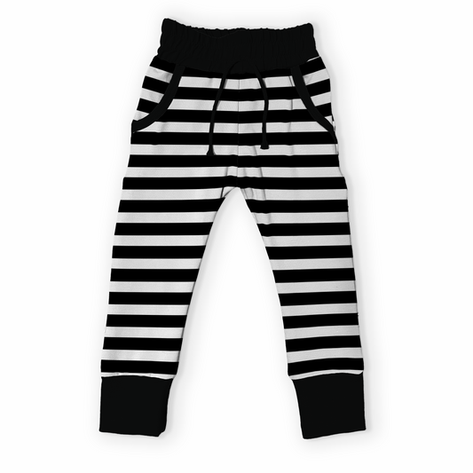 Handmade black and white striped pants with pockets on a white background