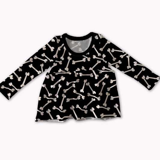 Black long-sleeve peplum shirt with white bone pattern on a white background