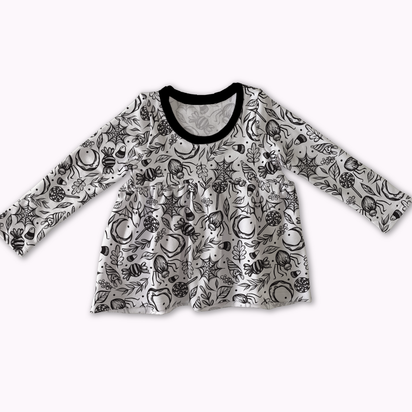 Peplum top from MySpookyBaby, white with black spooky cute design ; bats, spiderwebs, treats. Black neckline. 