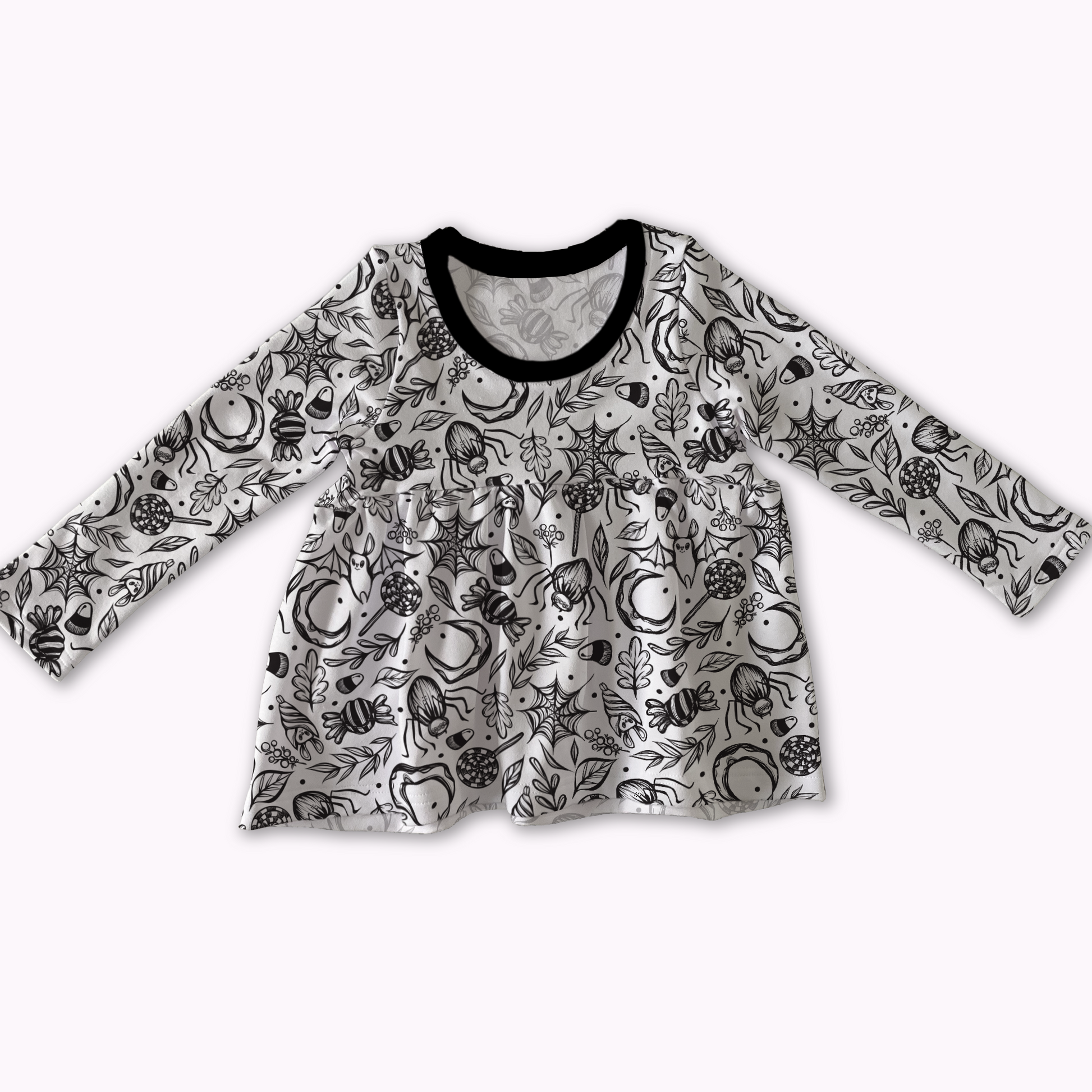 Peplum top from MySpookyBaby, white with black spooky cute design ; bats, spiderwebs, treats. Black neckline. 