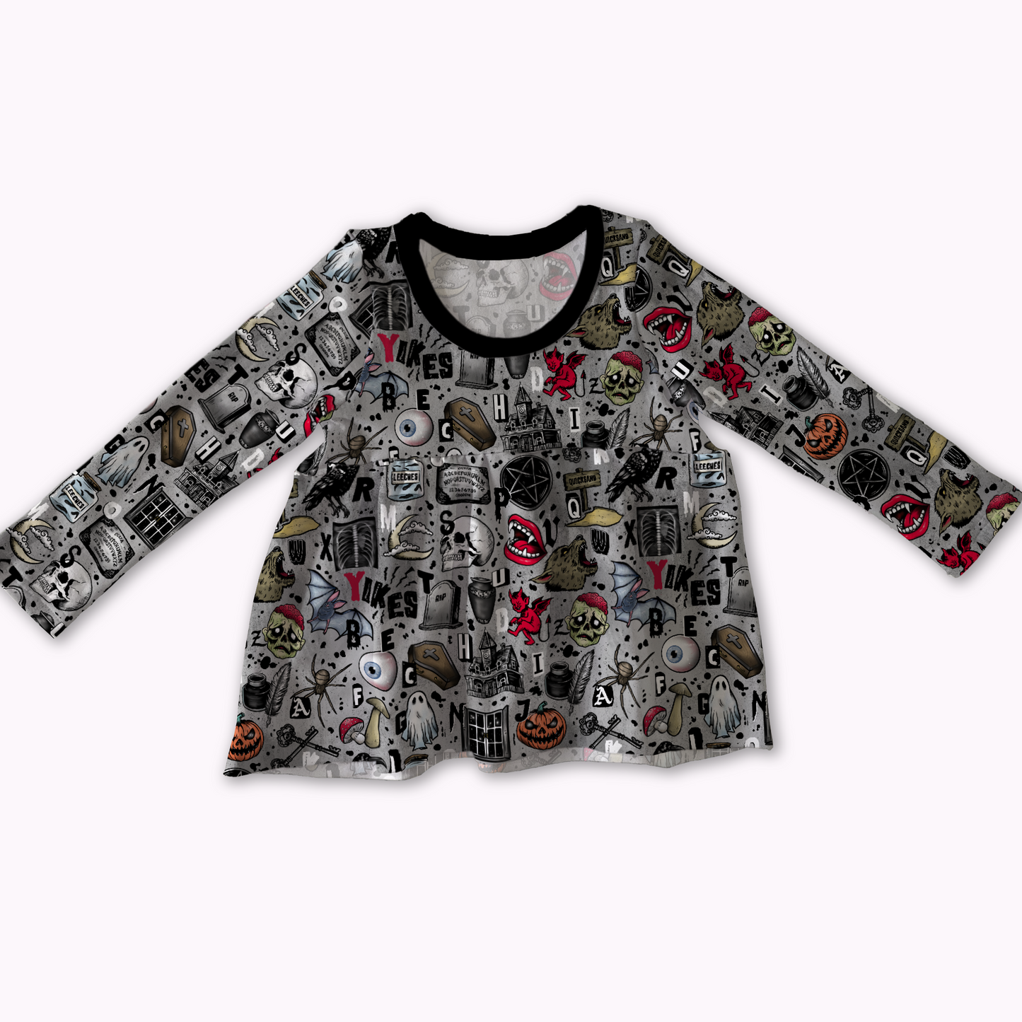 Long-sleeve peplum top, grey with spooky designs on it : pumpkins, skulls, pentagrams, coffins, ghosts
