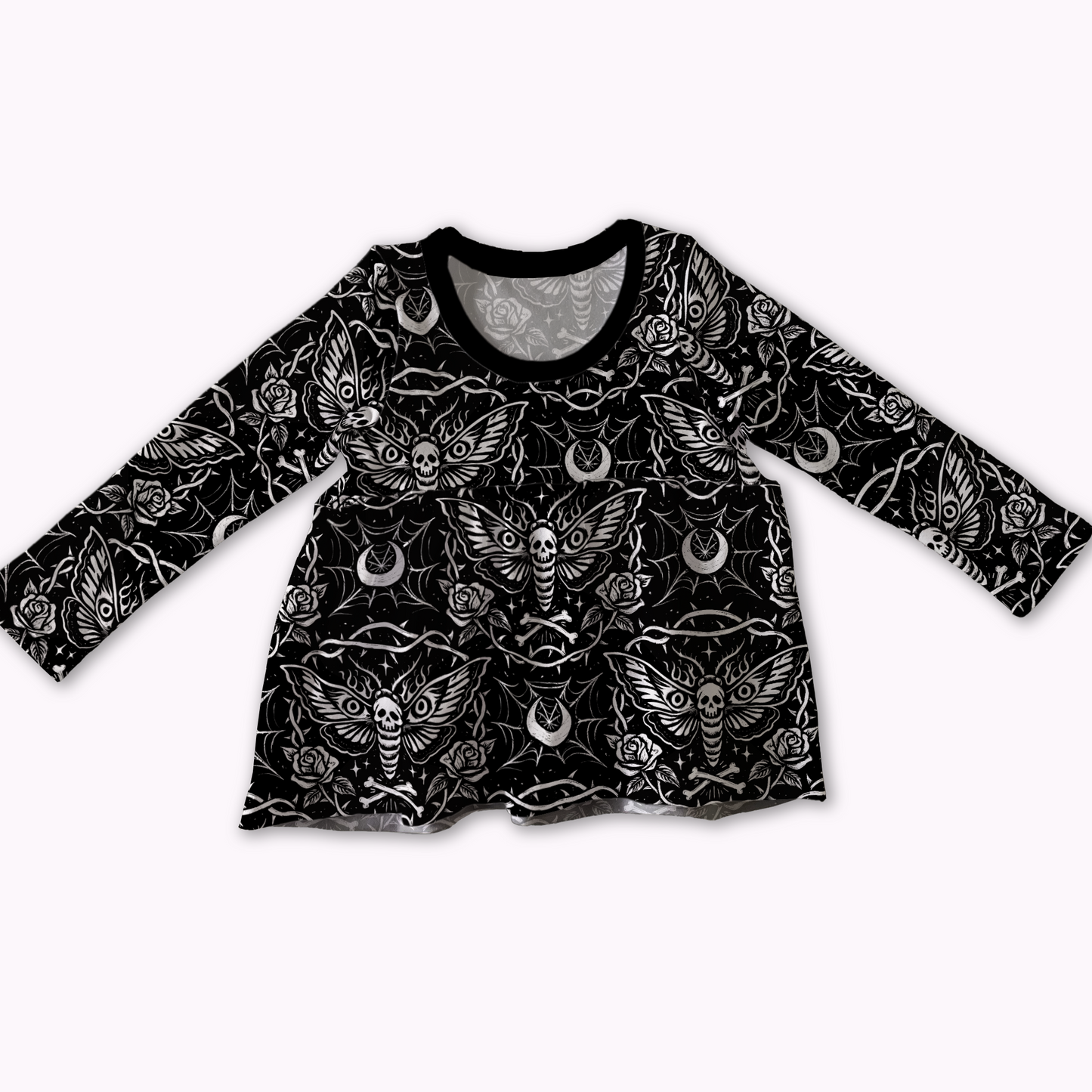 Handmade peplum top by My Spooky Baby, black long-sleeve shirt with white pattern featuring moth, moons, spiderwebs and bones. 