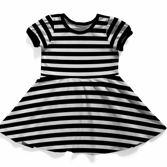 Black and white striped dress on a white background