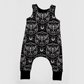 Gothic baby romper, black, with white designs : moths, spiderwebs, moons, roses and bones. 
Handmade by My Spooky Baby
