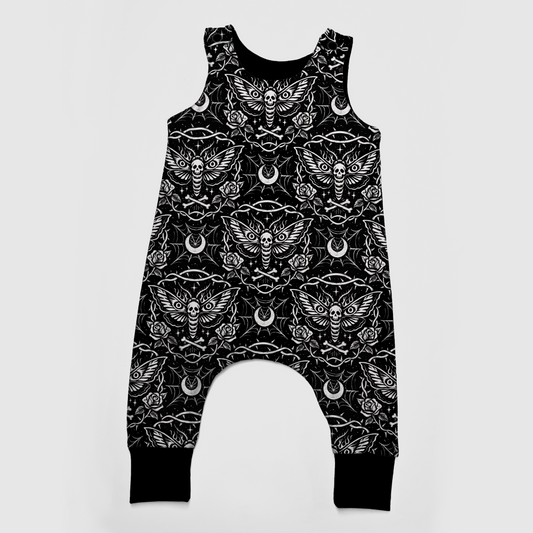 Gothic baby romper, black, with white designs : moths, spiderwebs, moons, roses and bones. 
Handmade by My Spooky Baby