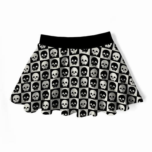 Skirt with black and white skull checkered pattern on a white background