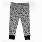 Spooky cute leggings, white with black designs : spiderwebs, spiders, bats, leaves, moons, and candies. Black cuffs at legs. Elasticat at waistband. 