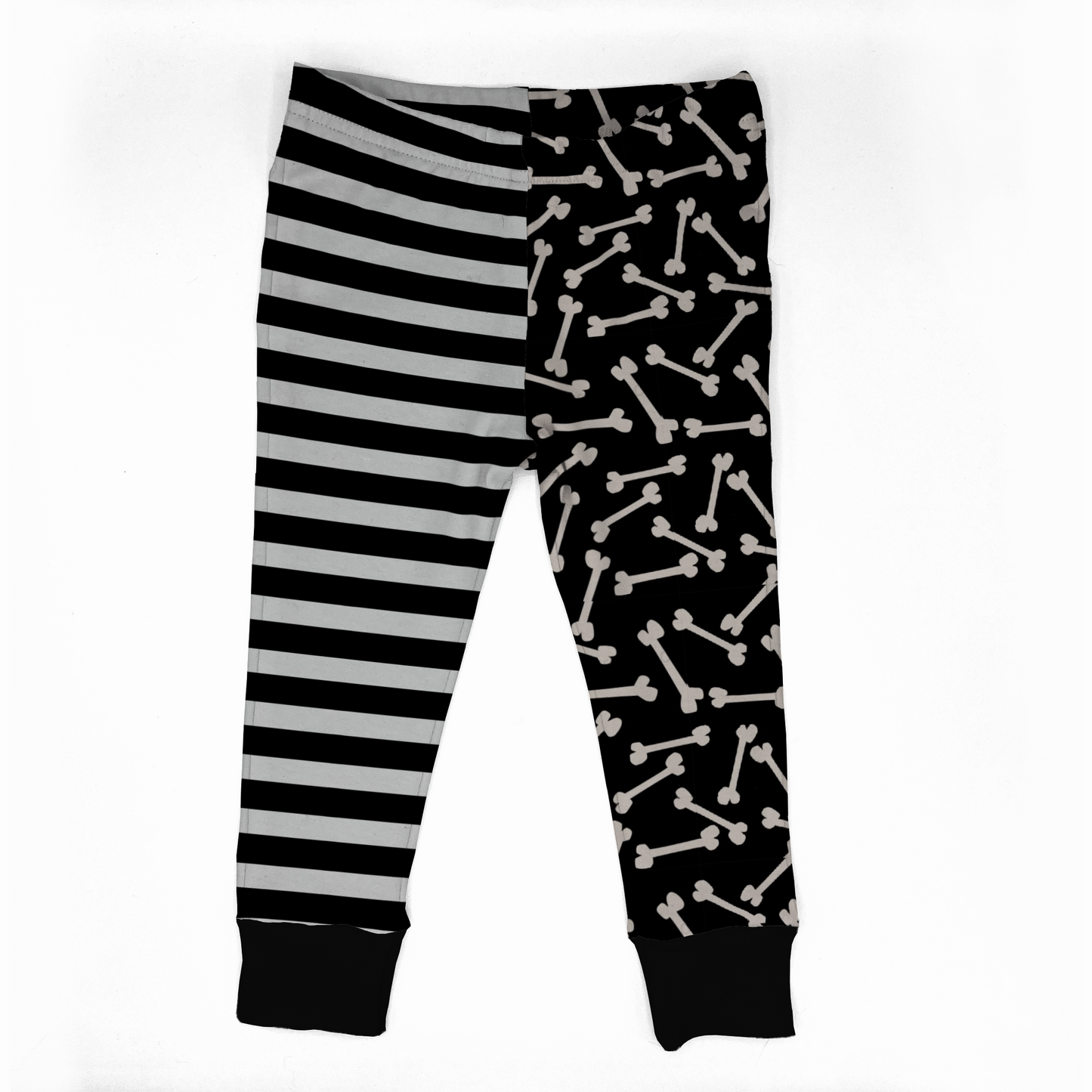 Kids leggings with 2 different legs. 
One with Black and white striped , the other with white bones on black background.