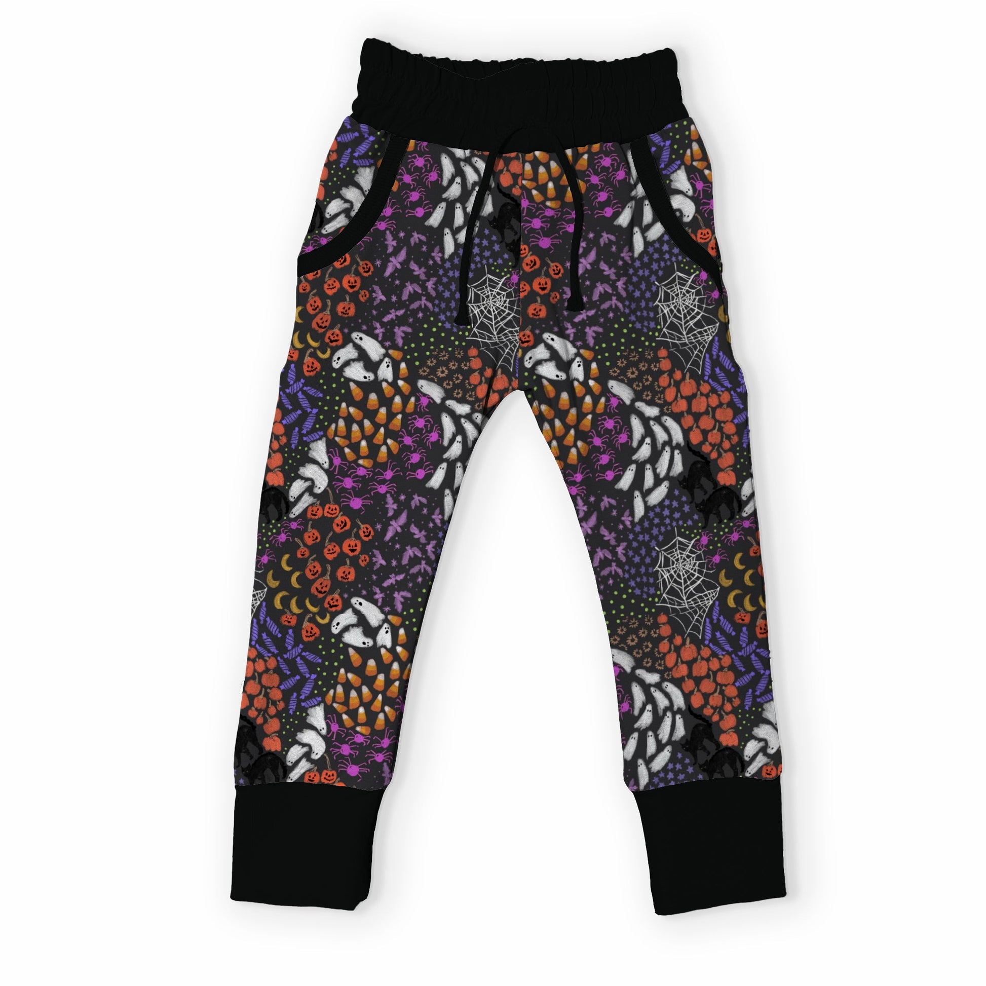 A pair of children's jogger pants featuring a vibrant Halloween-themed pattern with pumpkins, ghosts, spiderwebs, and bats in purple, orange, black, and white, finished with solid black cuffs and waistband.